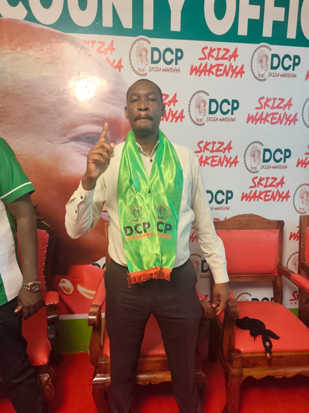 Patrick Maina Macharia wearing the DCP sash at the party&rsquo;s Kiambu County office