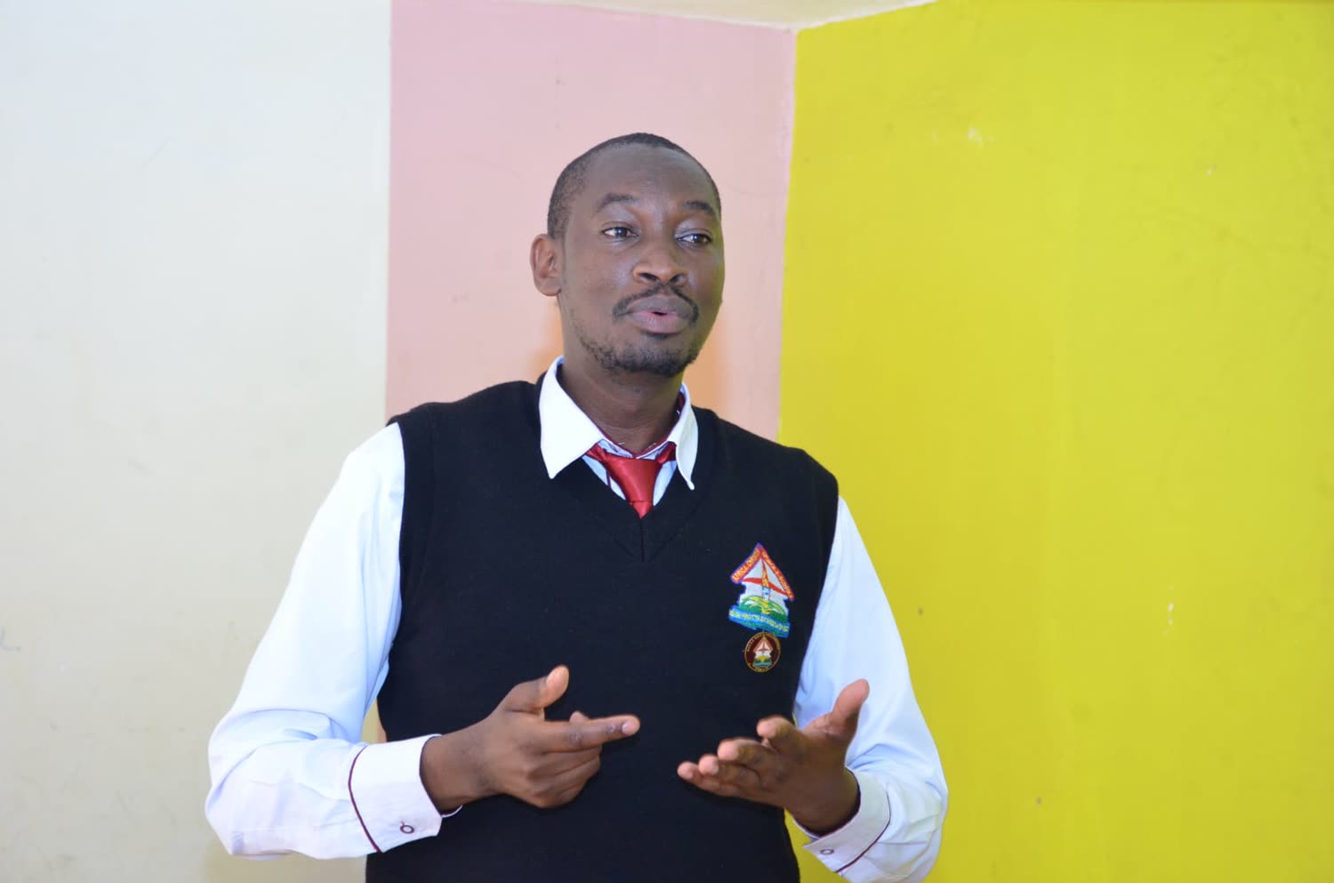 Maina in ACC&S Men&rsquo;s Fellowship uniform addressing a meeting
